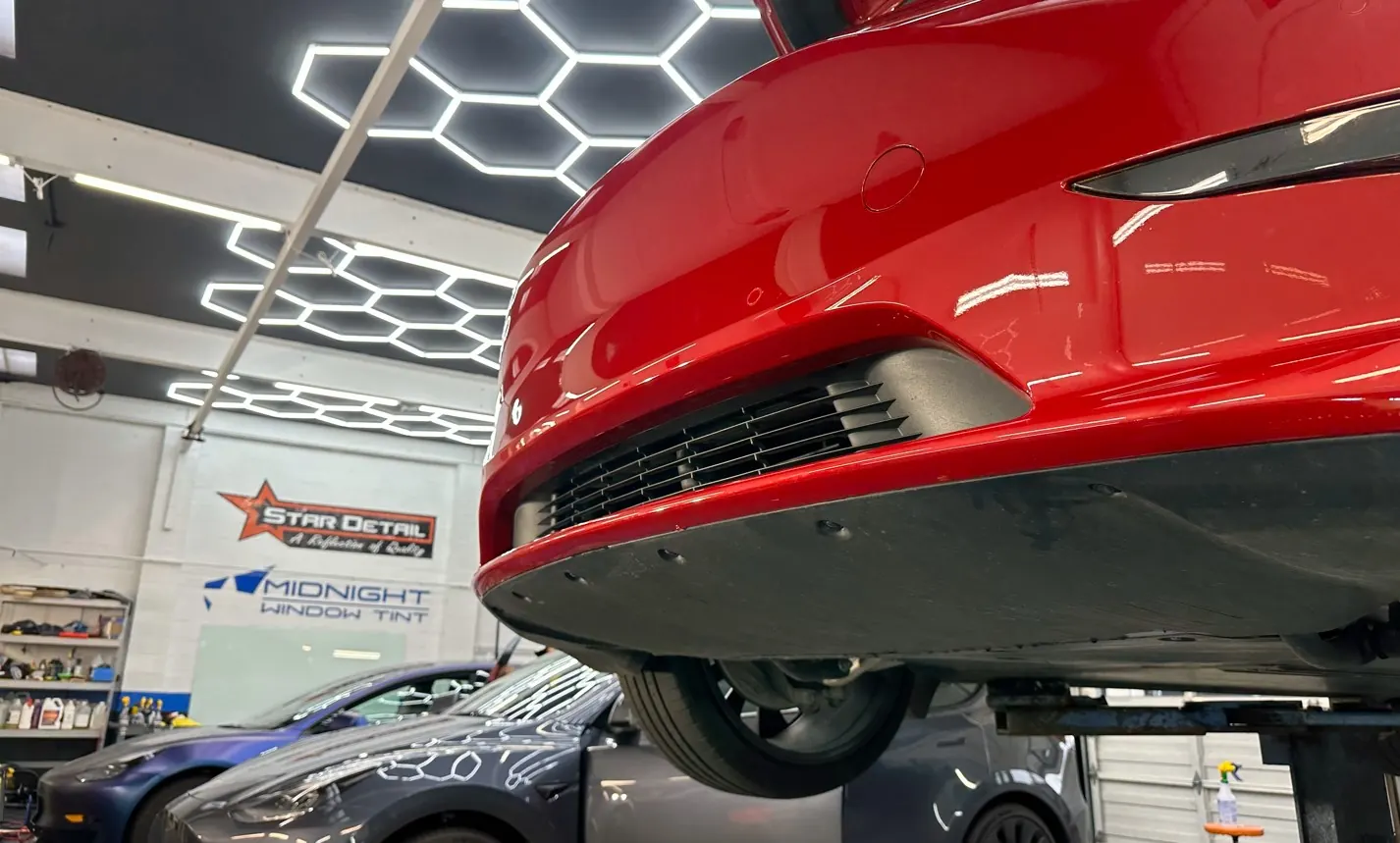 Bumper mid-install with paint protection film