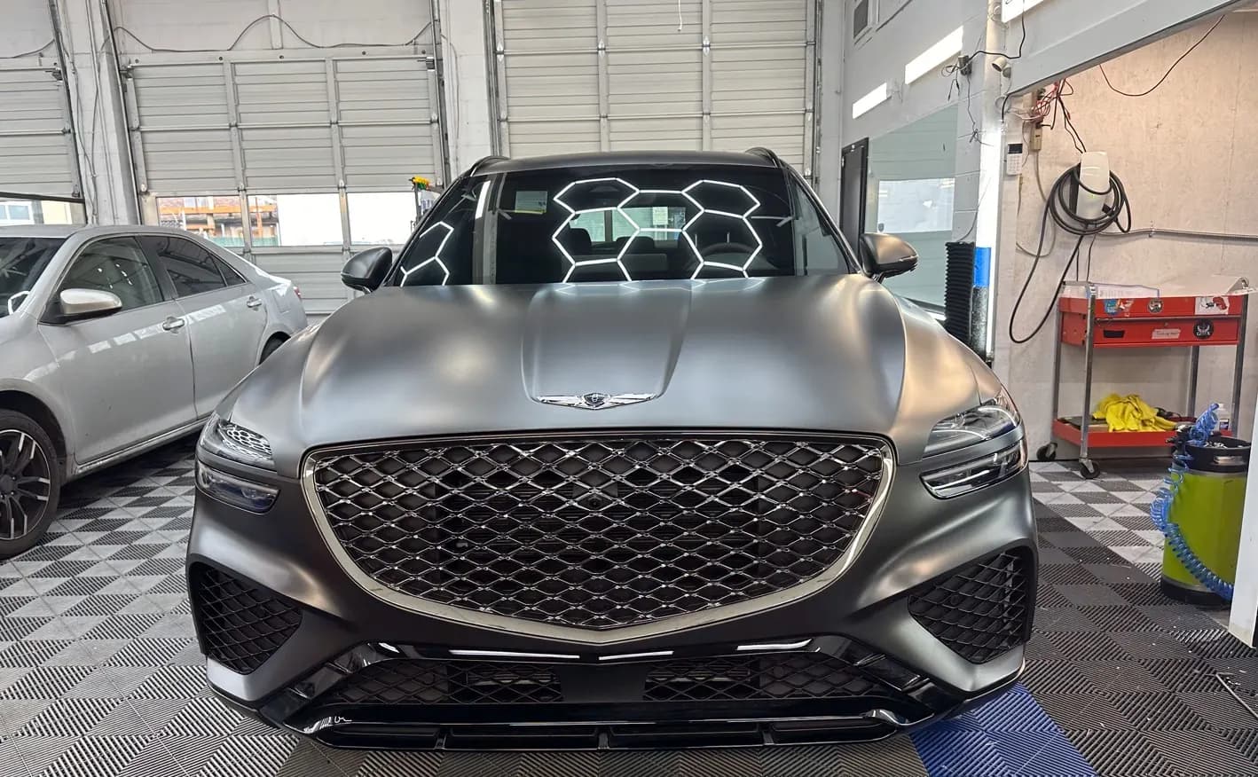 Genesis SUV with fresh paint protection film on the front end