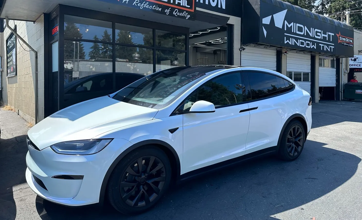 White Tesla in the shop bay